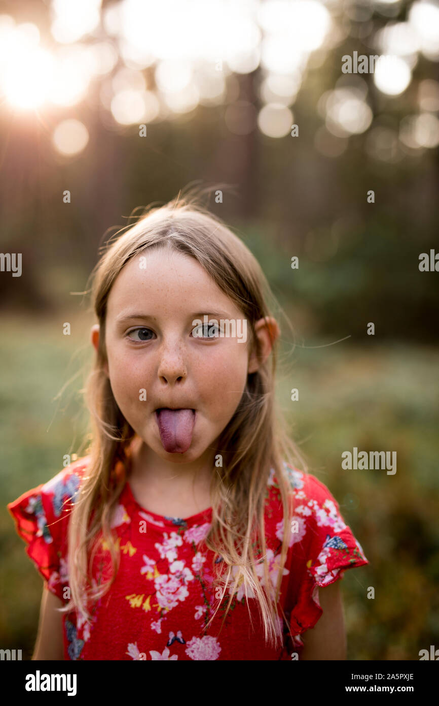 Girl sticking her tongue out Stock Photo Alamy