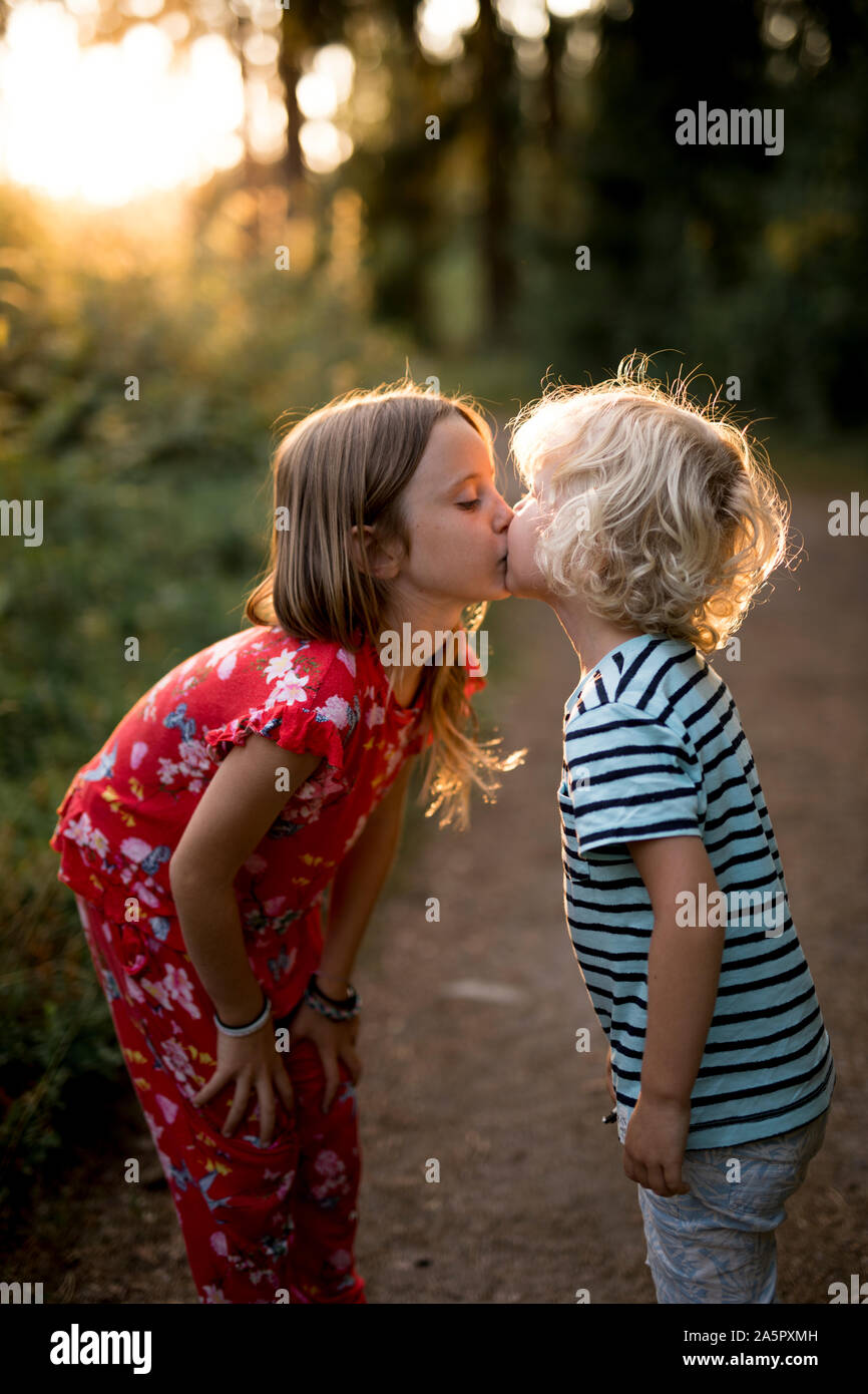 Brother and sister kissing Stock Photo Alamy