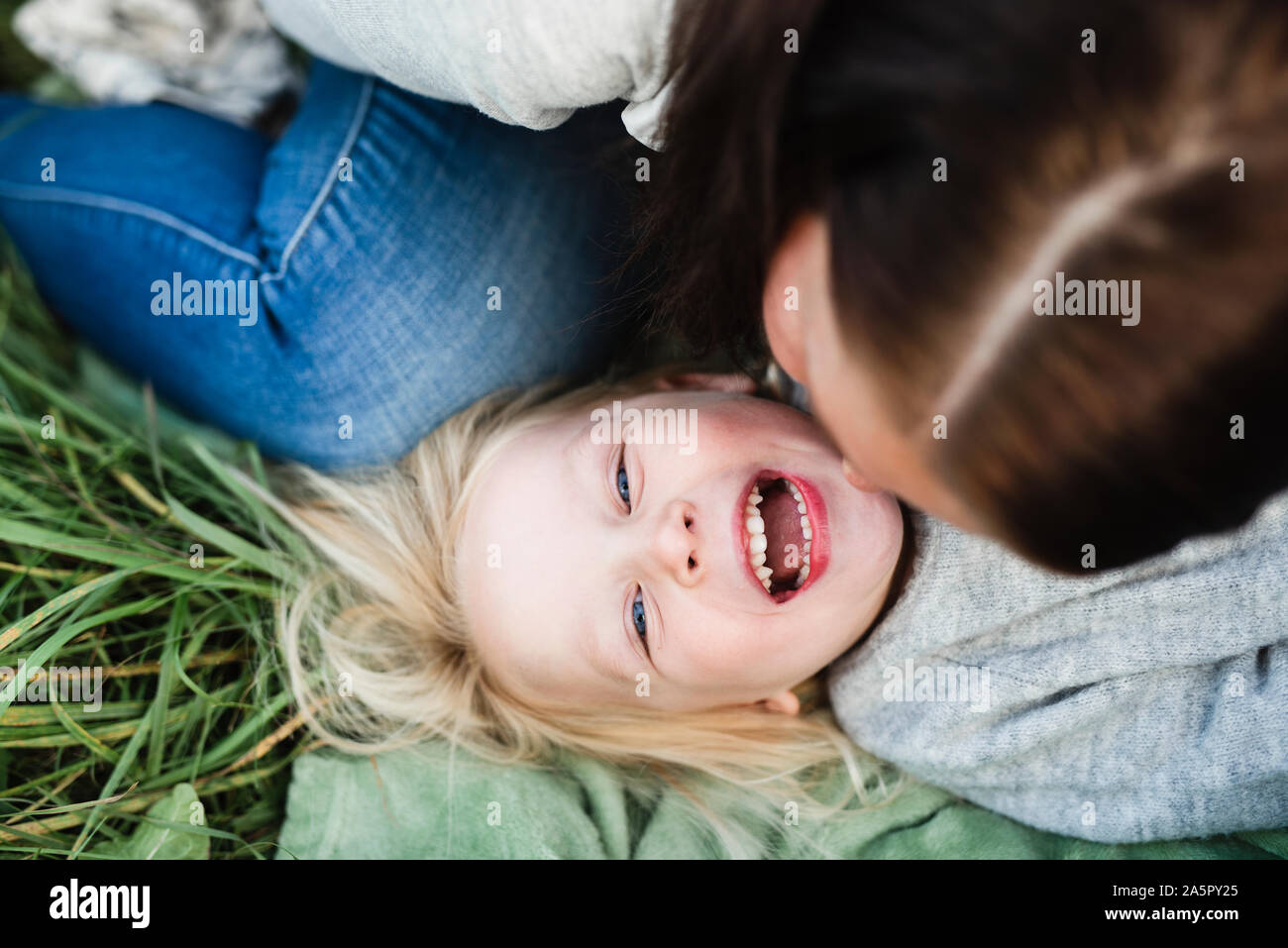 Happy girl playing with mother Stock Photo