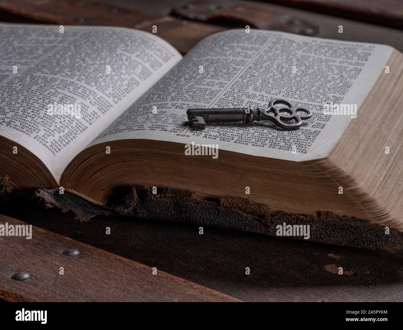 Key On Top Of Open Holy Bible Stock Photo