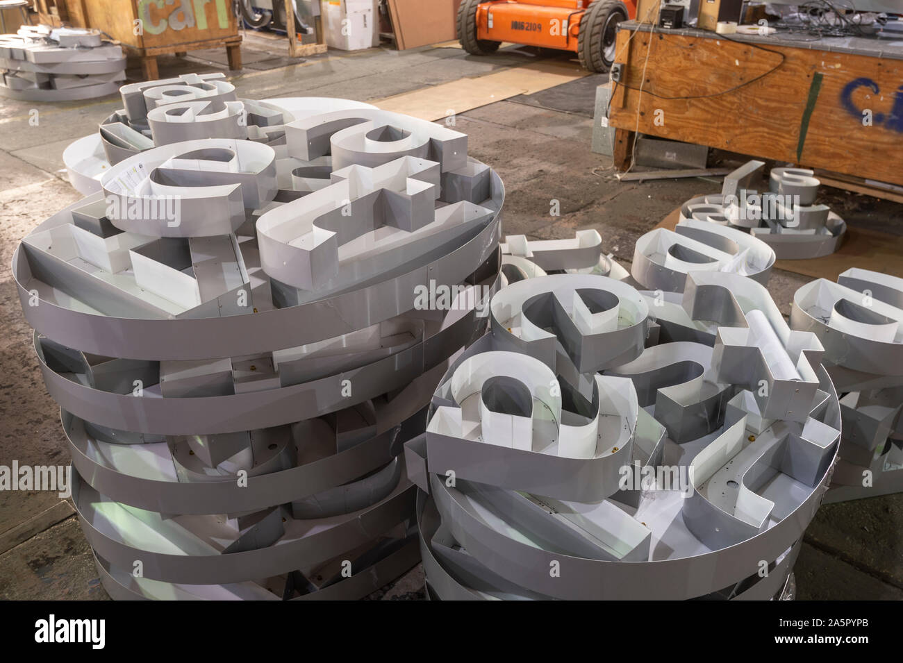 Pile of white letters in sign manufacturing factory facility Stock Photo