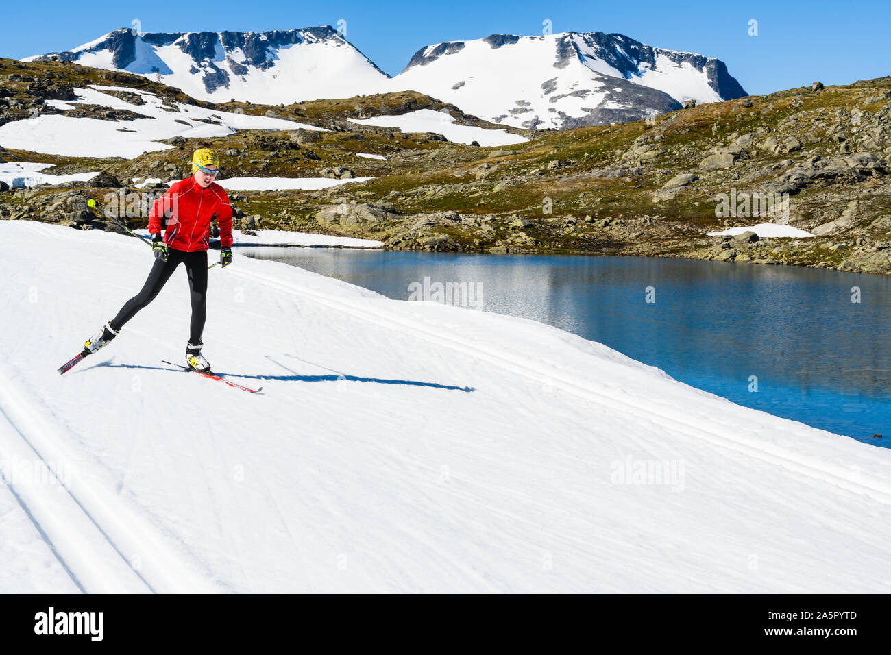 Man cross-country skiing in mountains Stock Photo
