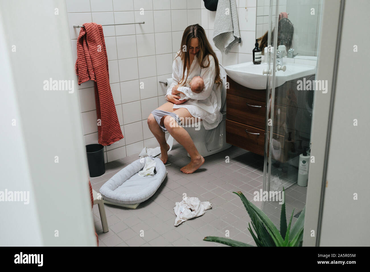 Blond Girl Peeing Seated On A Toilet With Her Panties Down Isolated On  White Background Stock Photo, Picture and Royalty Free Image. Image  31616610.
