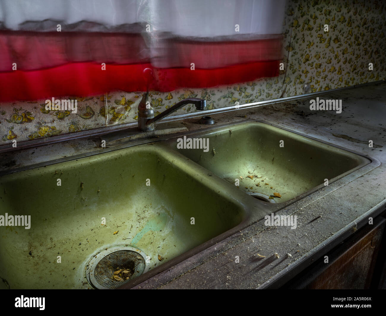 Neglected and abandoned kitchen sink Stock Photo