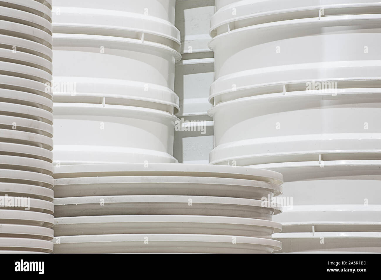 Stack of white buckets Stock Photo
