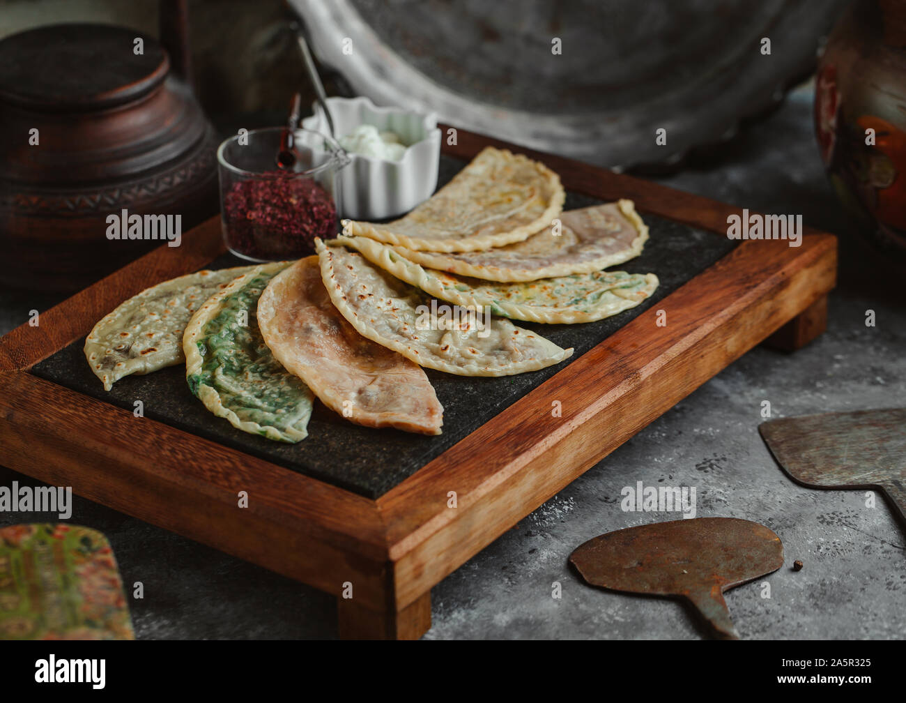 gutab stuffed flatbreads board served with sumac and yoghurt Stock