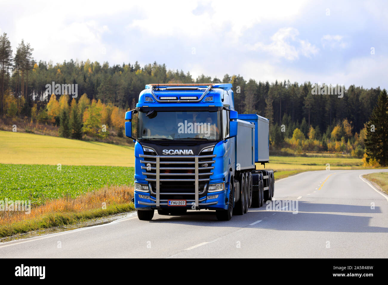 Blue Scania R650 truck with bull bar of Kuljetusliike Markus Hanninen for limestone haul on the road in autumn in Salo, Finland. October 4, 2019. Stock Photo