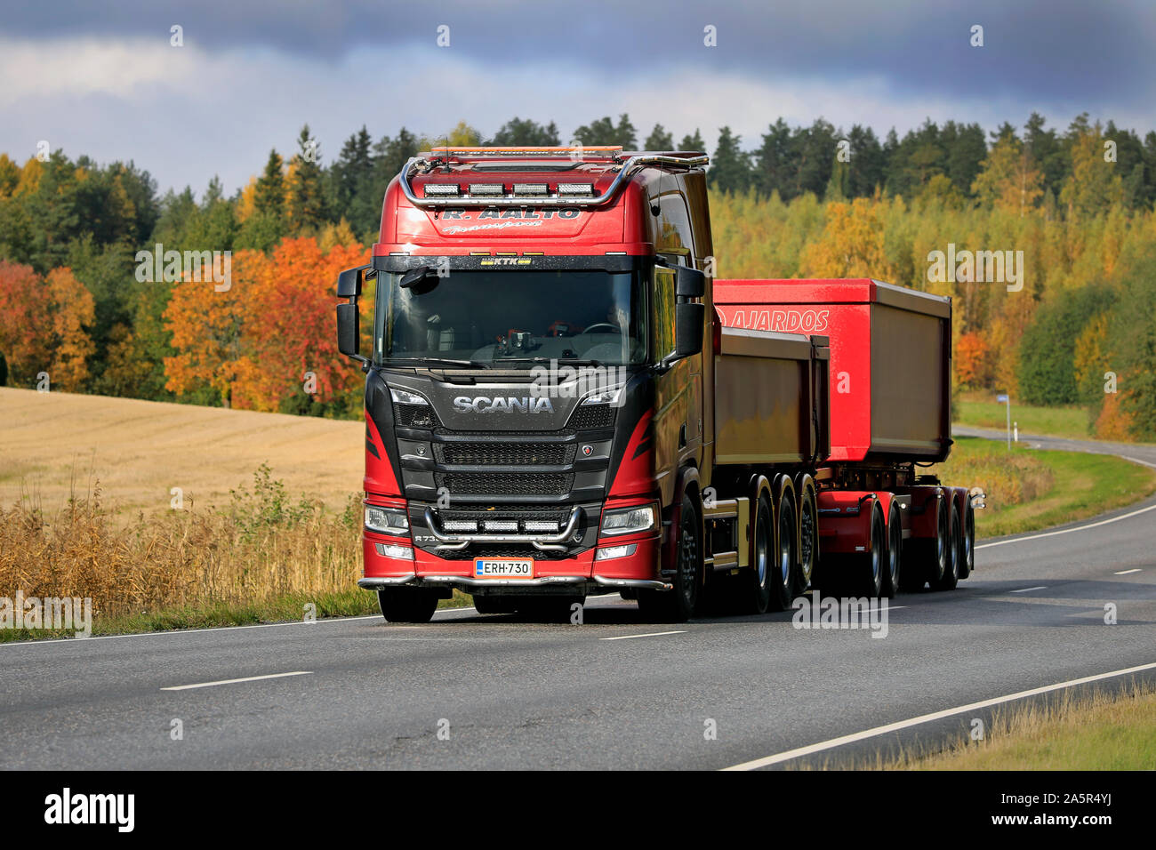 New, red Scania R730 truck and gravel trailer for limestone haul of Transport R Aalto on the road in autumn in Salo, Finland. October 4, 2019. Stock Photo
