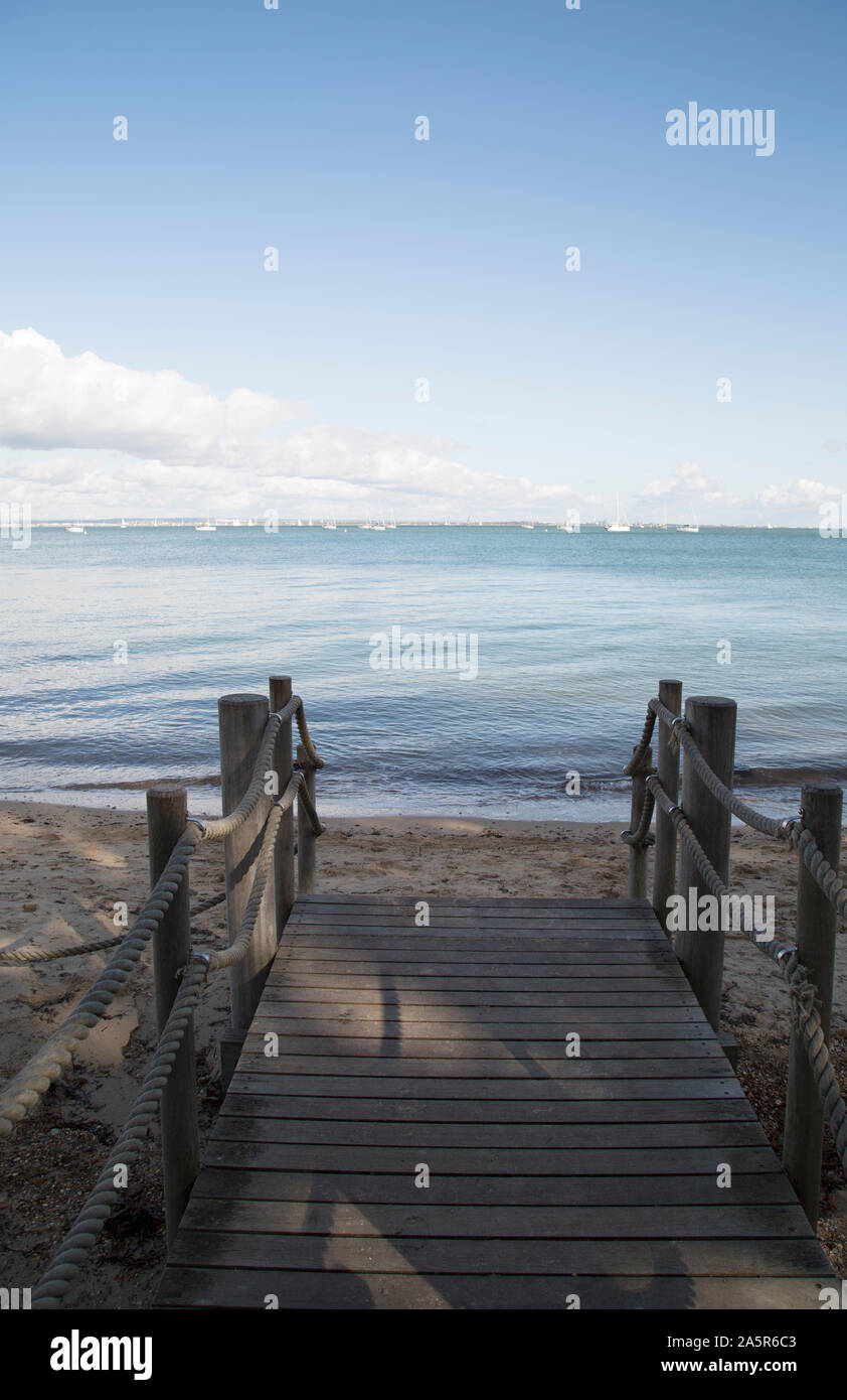 Small jetty, Osborne Bay looking out on the Solent a stretch of water between Portsmouth, Isle of Wight, UK Stock Photo