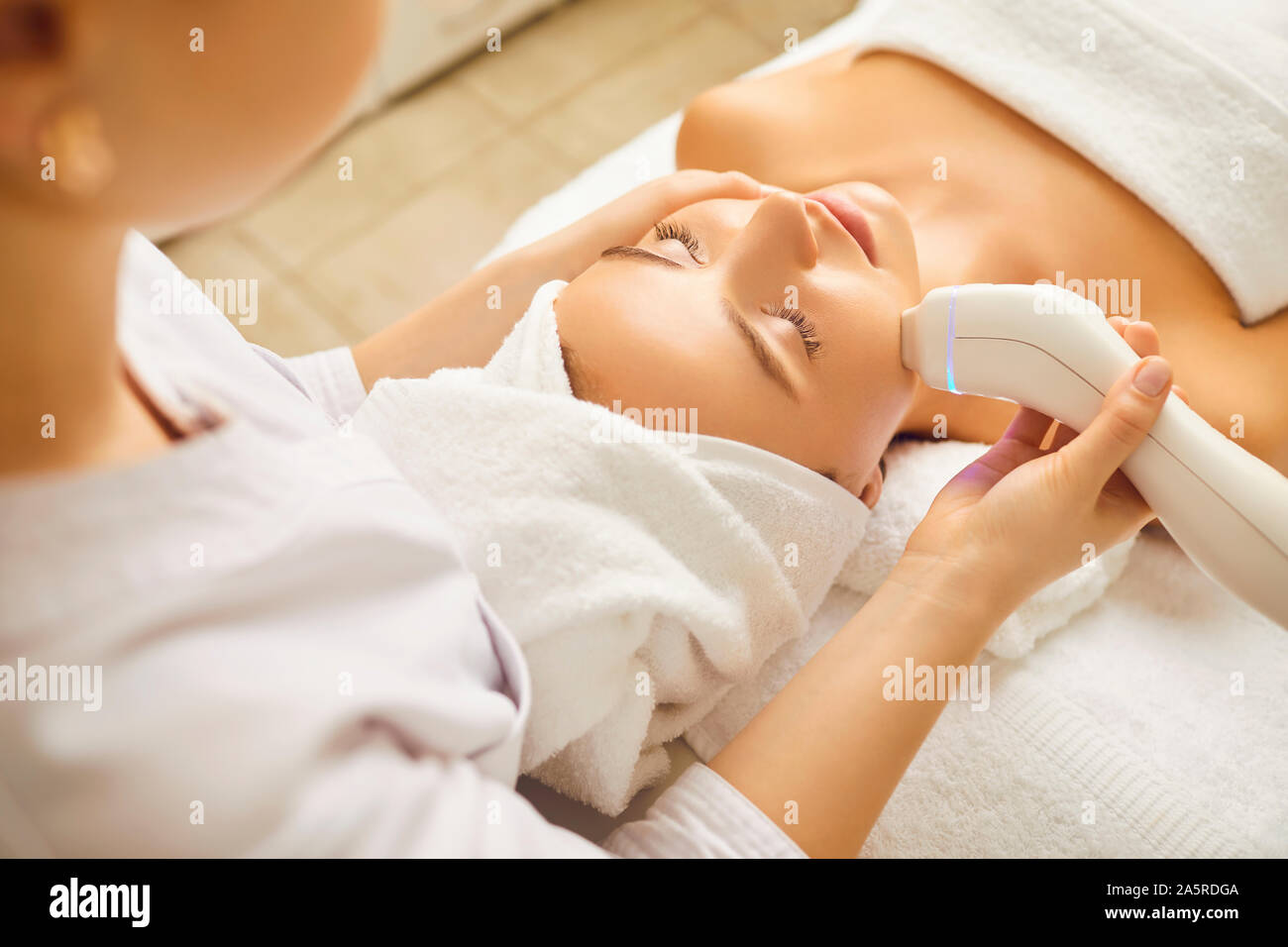 Facial hardware cosmetology. Cosmetology head procedure. Stock Photo