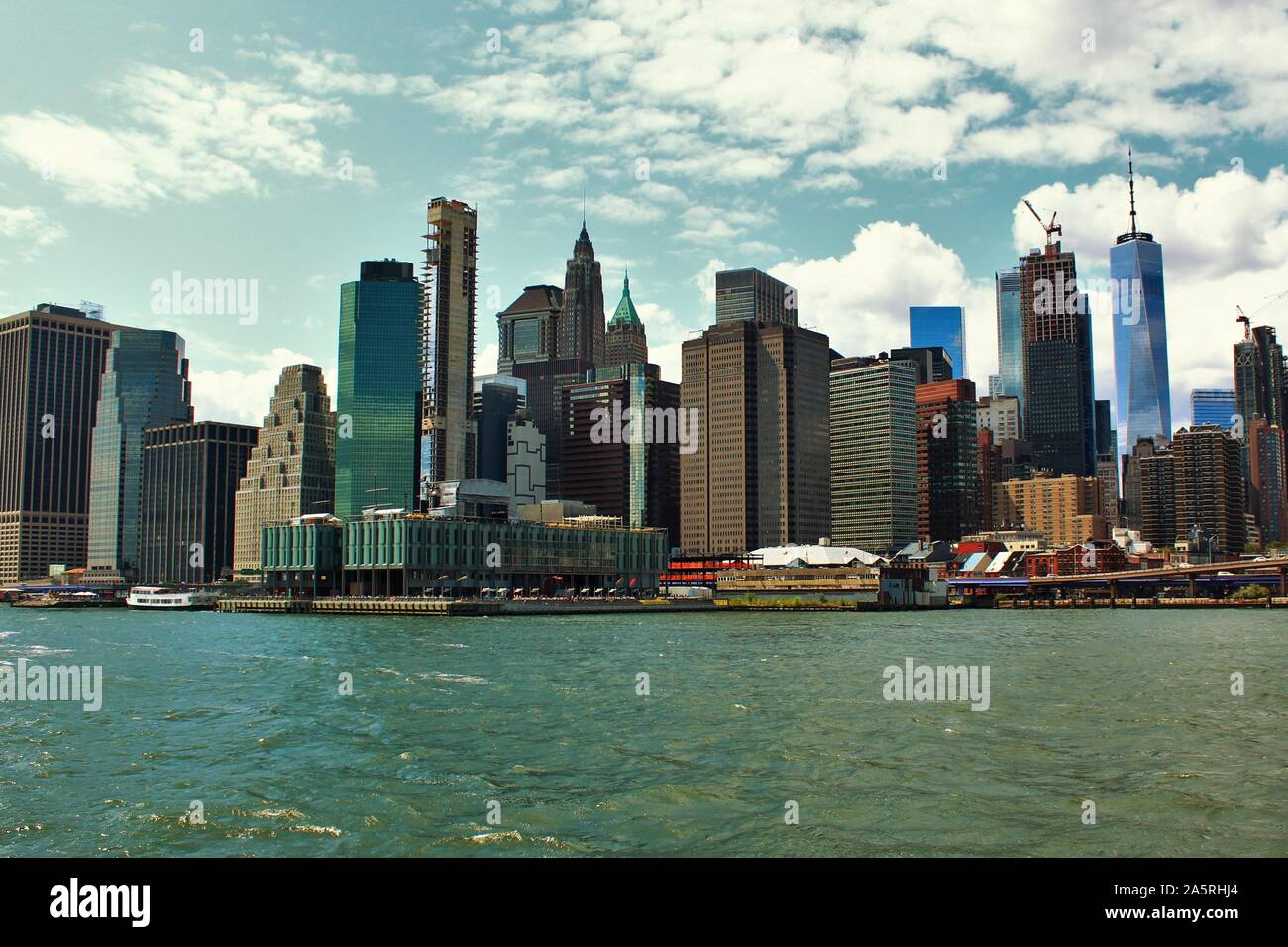 View from the East River in New York City, of the skyscrapers that make up the skyline of Downtown Lower Manhattan. Stock Photo