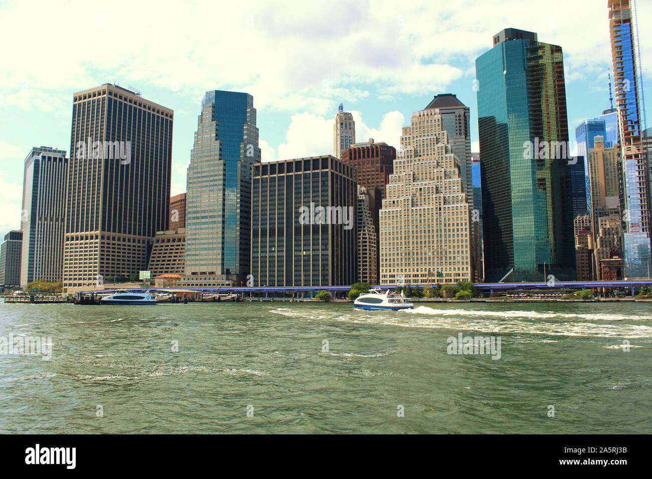 View from the East River, New York City, of some of the skyscrapers that form the iconic, scenic, skyline of Downtown Lower Manhattan. Stock Photo