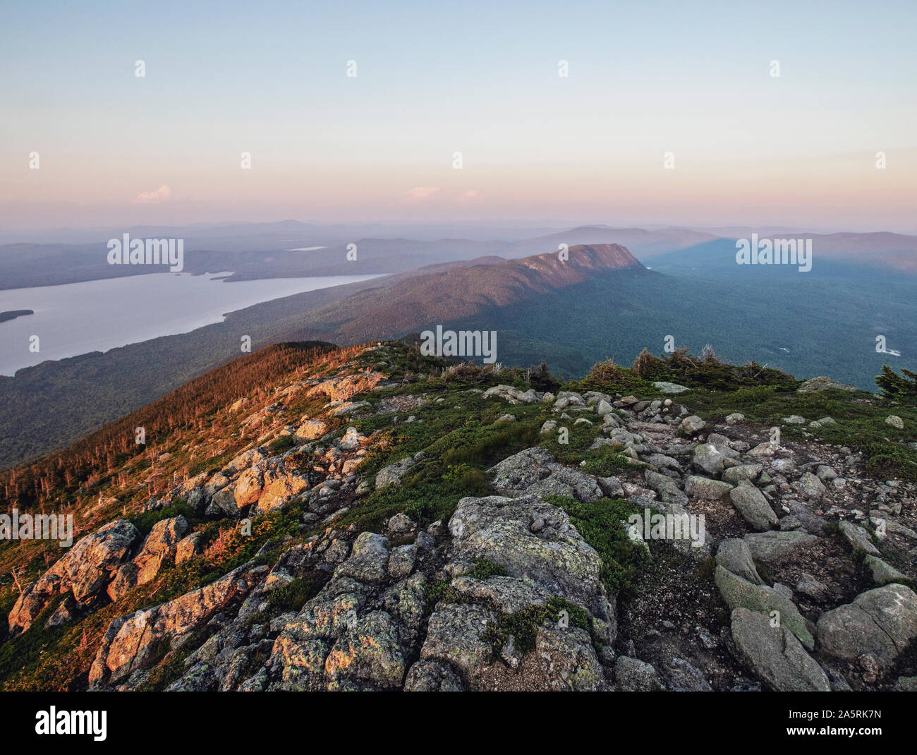 The sun sets on the Appalachian Trail over mountains and lakes, Maine