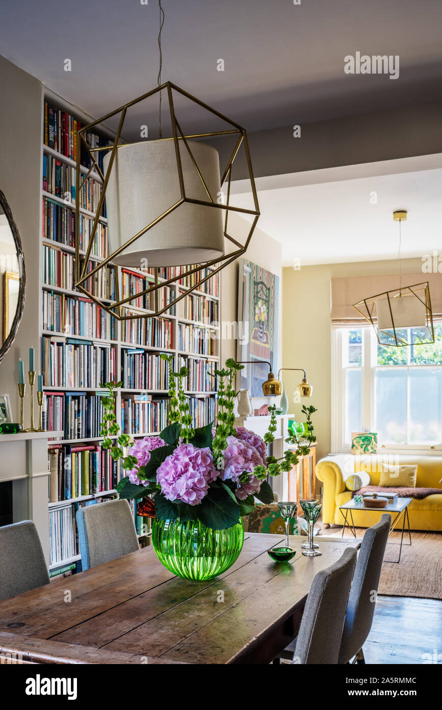 Double height book shelving in open plan interior Stock Photo Alamy