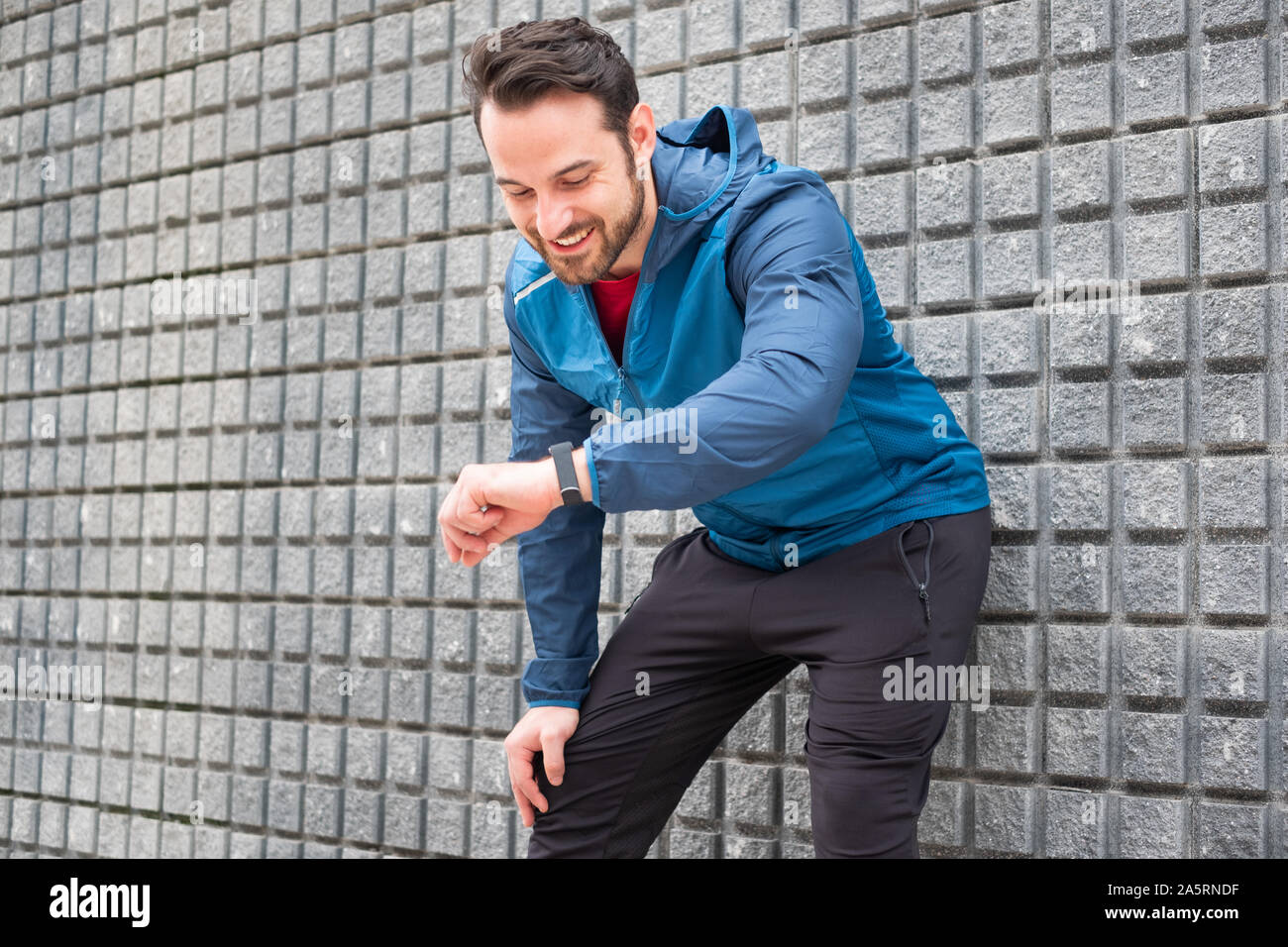 Sportsman checking sportwatch data and personal record Stock Photo
