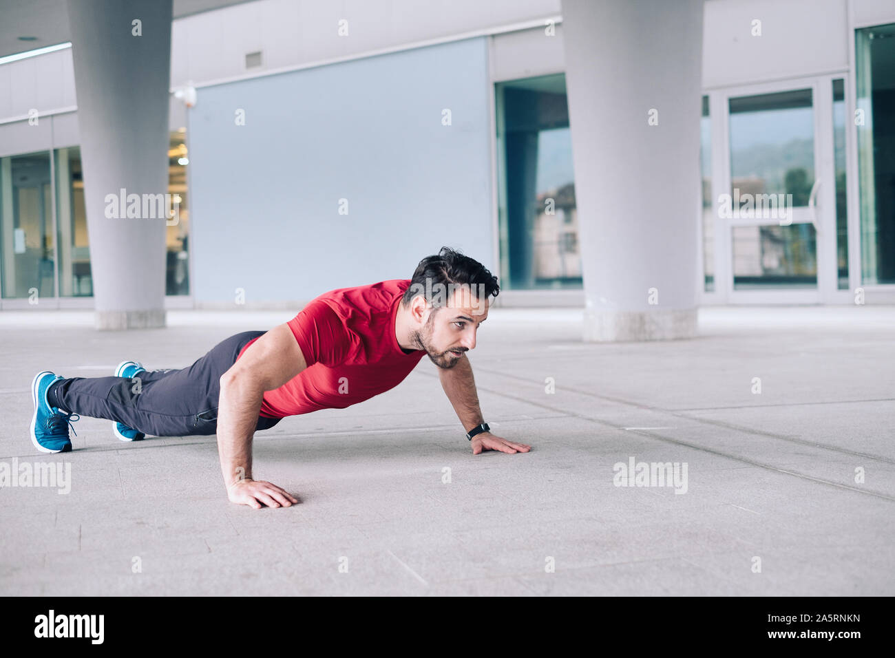 One athlete training with push-up repetitions exercise Stock Photo