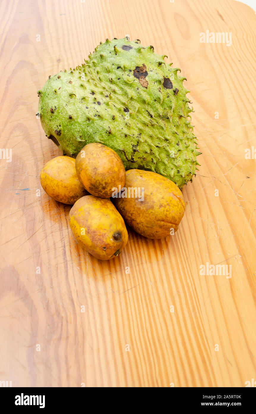 Ripe Soursop and Plums Stock Photo