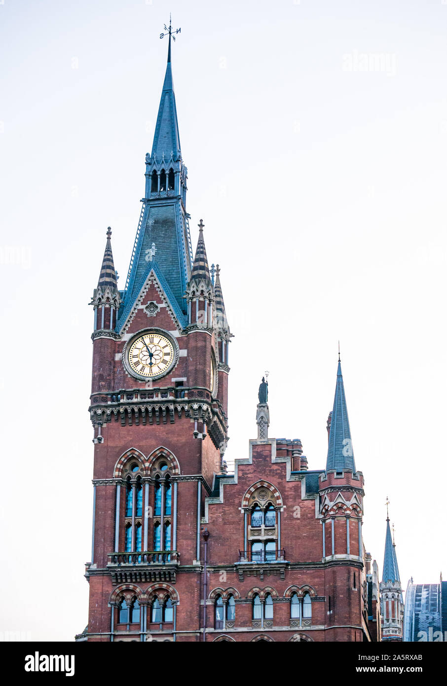 Ornate Victorian Gothic architecture clock spire, St Pancras railway station, London, England, UK Stock Photo