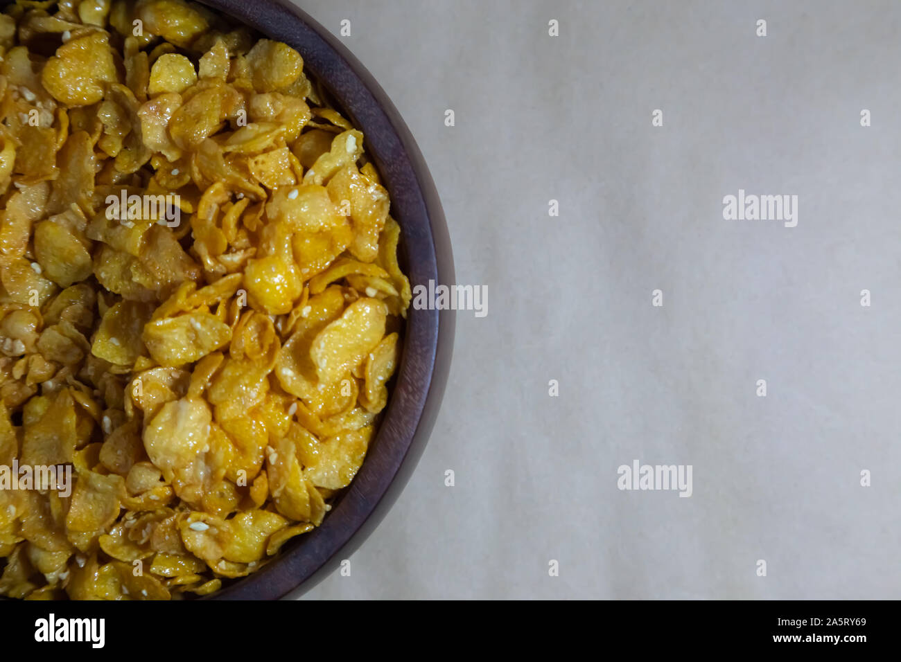 Close up Honey coated puffed wheat breakfast cereal on gray baclground. Stock Photo