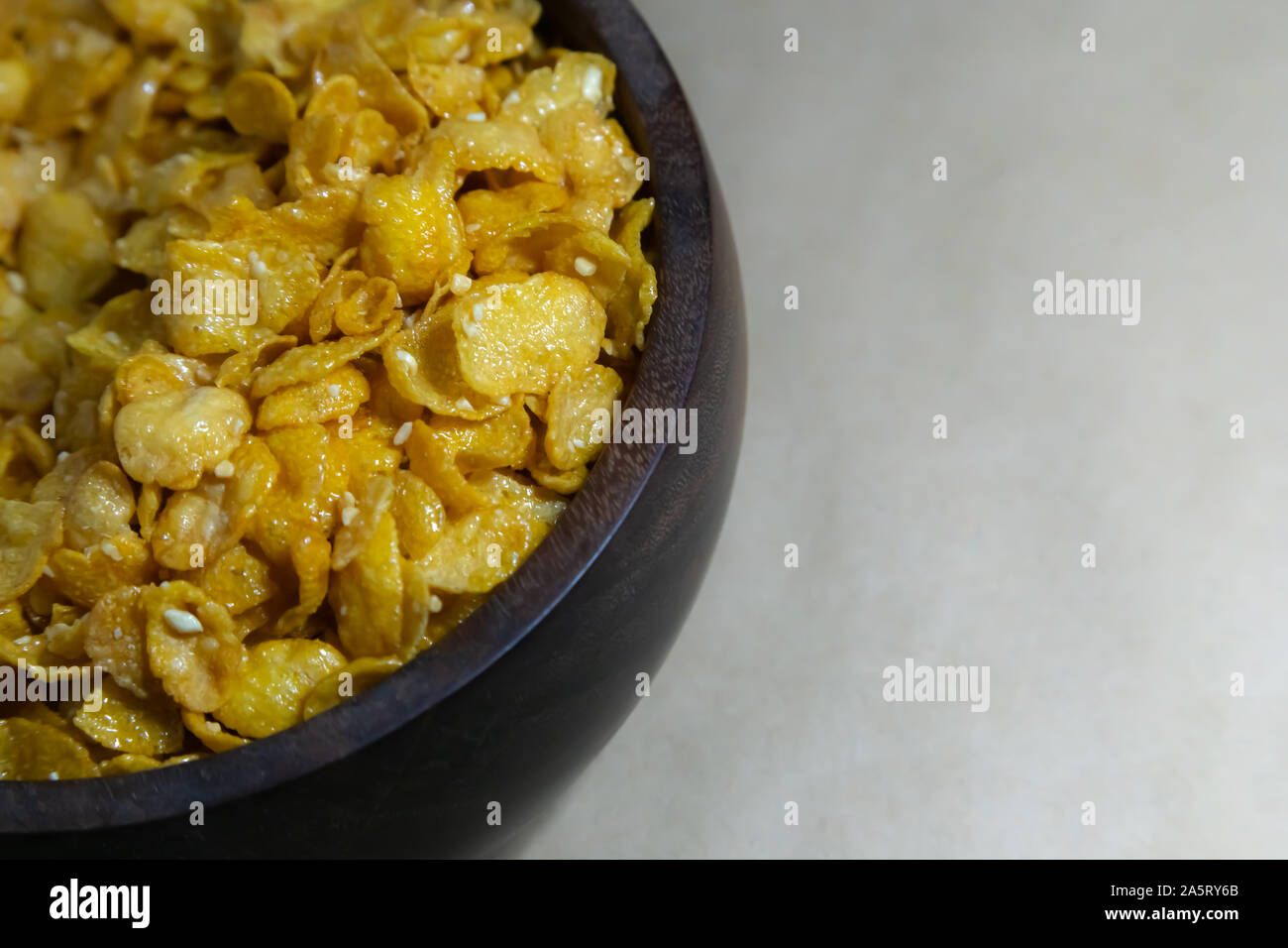 Close up Honey coated puffed wheat breakfast cereal on gray baclground. Stock Photo