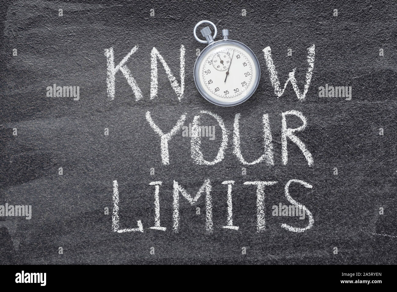 know your limits phrase written on chalkboard with vintage precise stopwatch Stock Photo