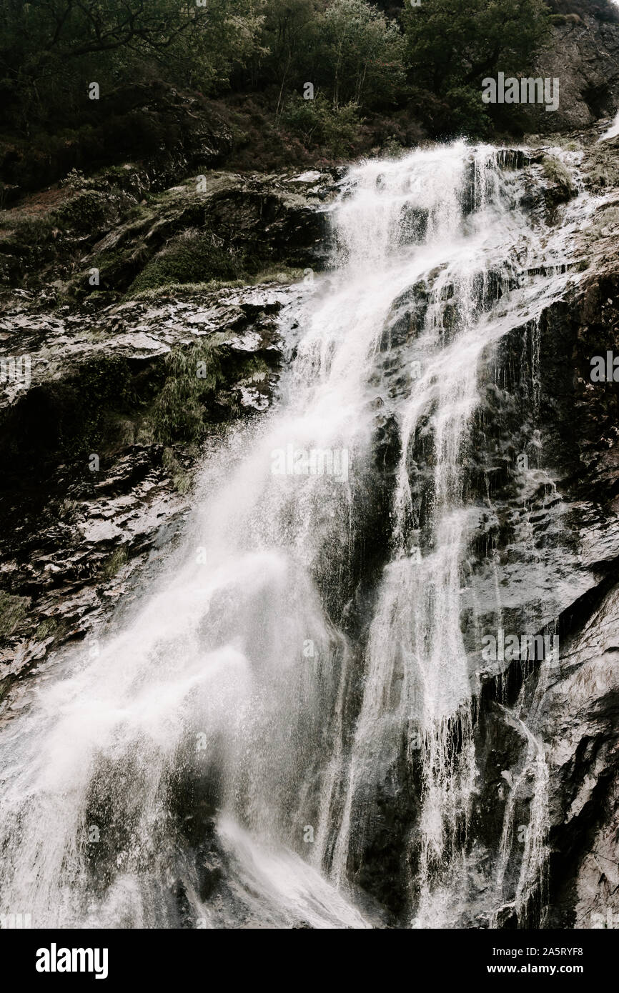 Powerscourt waterfall, highest waterfall in Ireland, Co Wicklow, nature, natural water spray muted colours, black white, flowing, flow Stock Photo