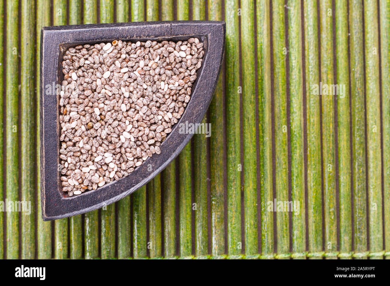 chia grains in container on rustic wood Stock Photo - Alamy