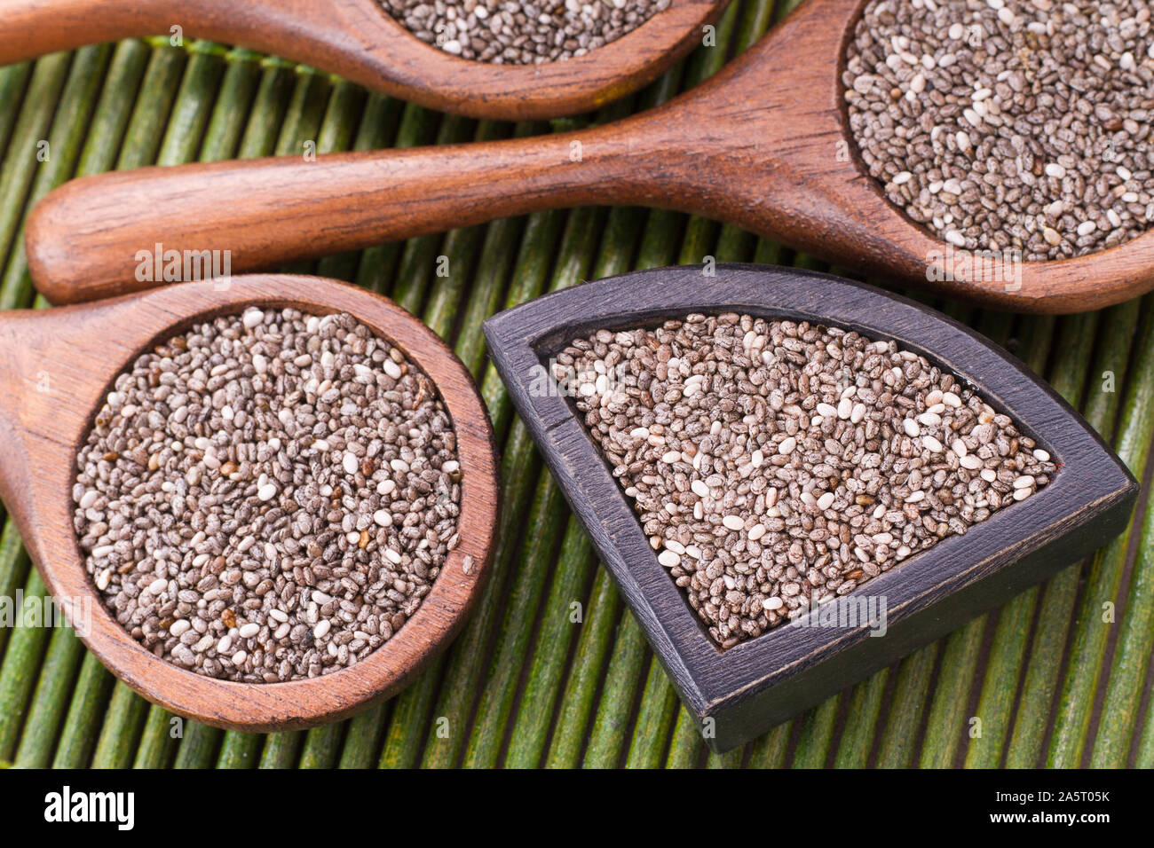 chia grains in container on rustic wood Stock Photo - Alamy