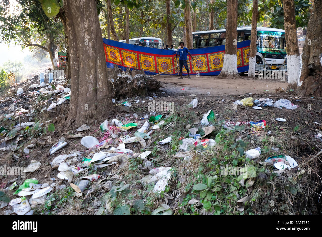 Indian tourists leave garbage at their picnic site on the Umsiang River in Umsiang. Assam State