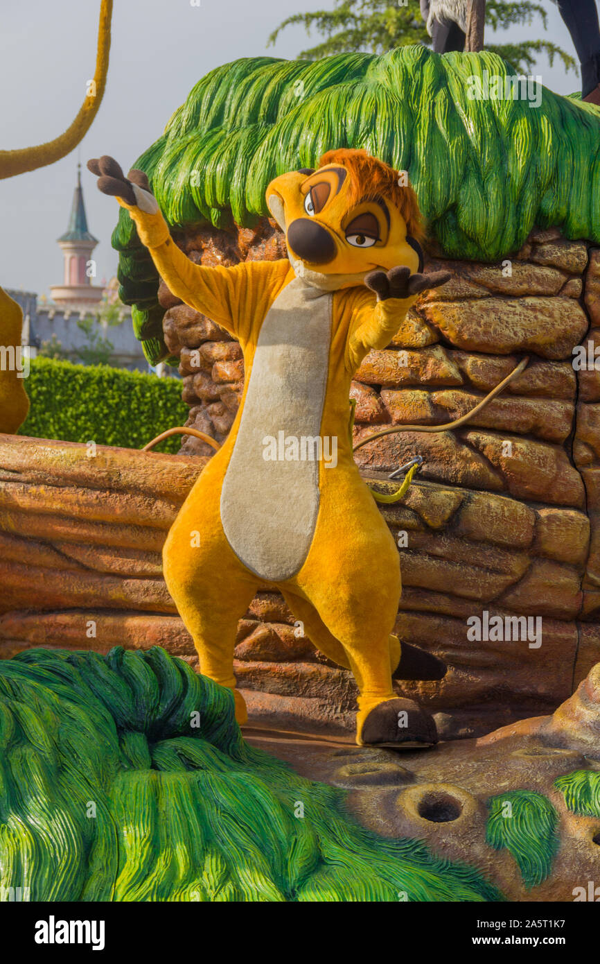 A picture of someone dressed as Timon, from The Lion King movie, in Disneyland Paris. Stock Photo