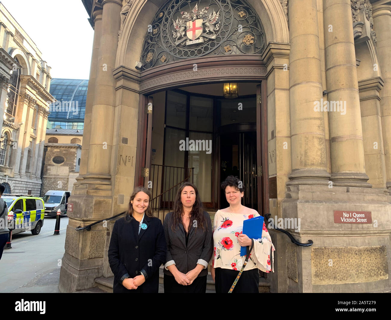 (left to right) Extinction Rebellion protesters Shulamit Morris-Evans, Amy Pritchard and Angela Ditchfield standing outside London Magistrates' Court, as the three women who glued themselves to an office building used by a 'murderous' coal company have been convicted of criminal damage. Stock Photo