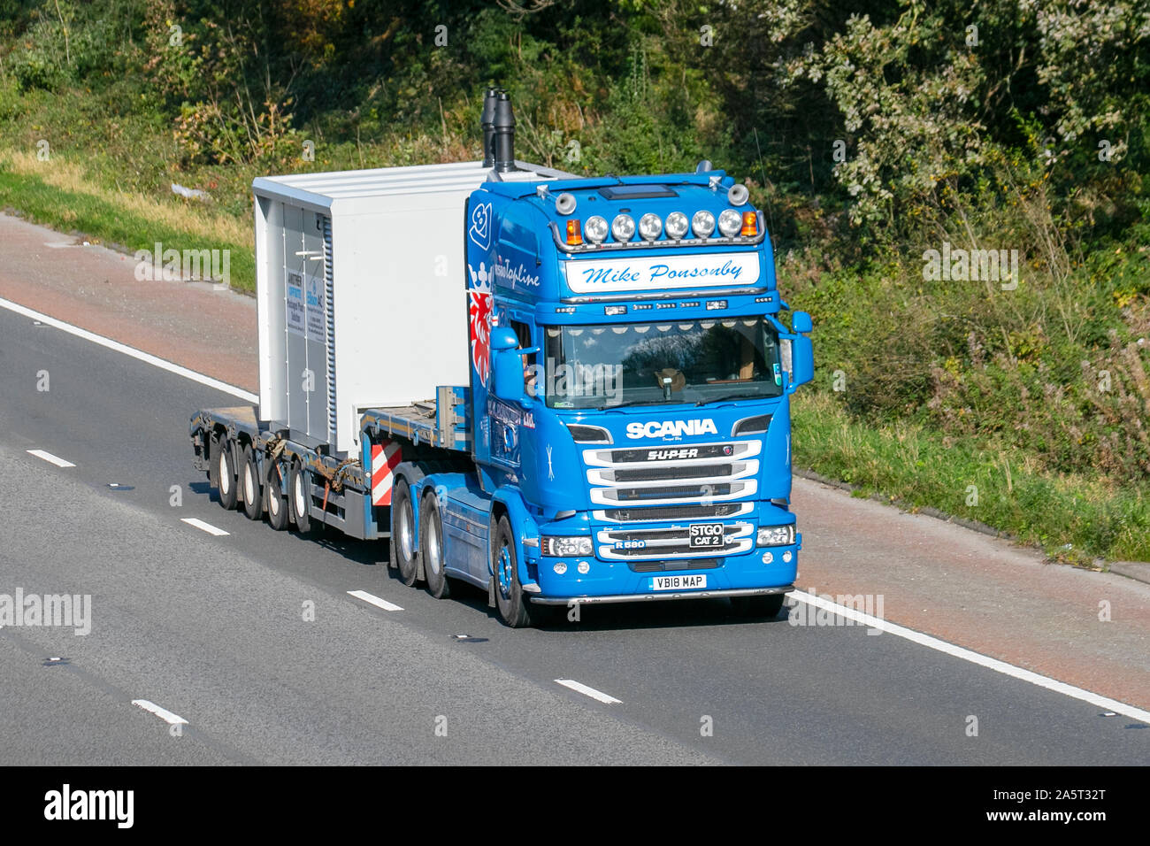 Mike Ponsonby Ellison AC Packaged Plant Solutions; Haulage delivery trucks, lorry, transportation, truck, cargo, Super Scania R500 vehicle, delivery, commercial transport, industry, supply chain freight, on the M6 at Lancaster, UK Stock Photo