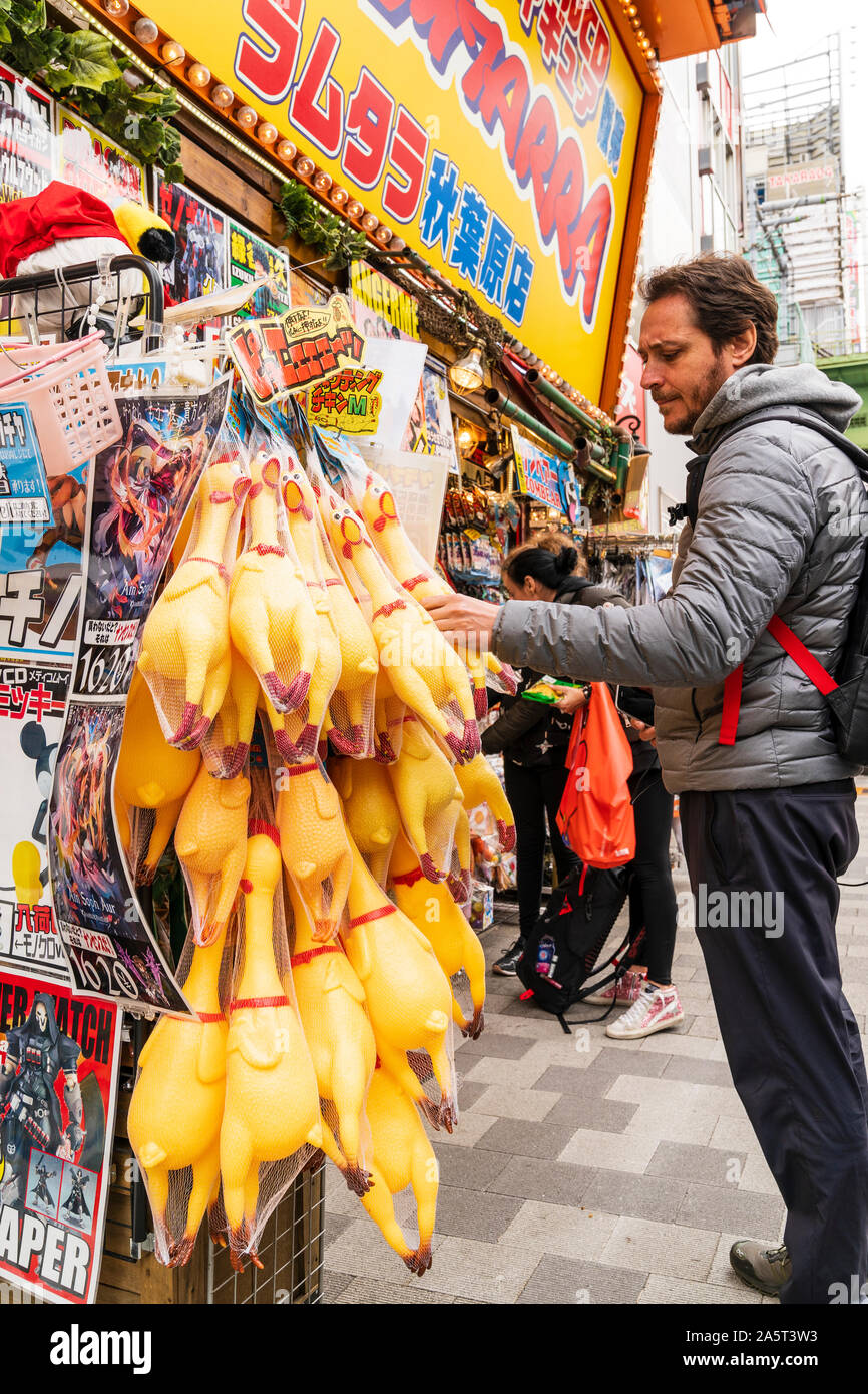 Tokyo, Akihabara. Store selling Otaku goods and souvenirs. Western man