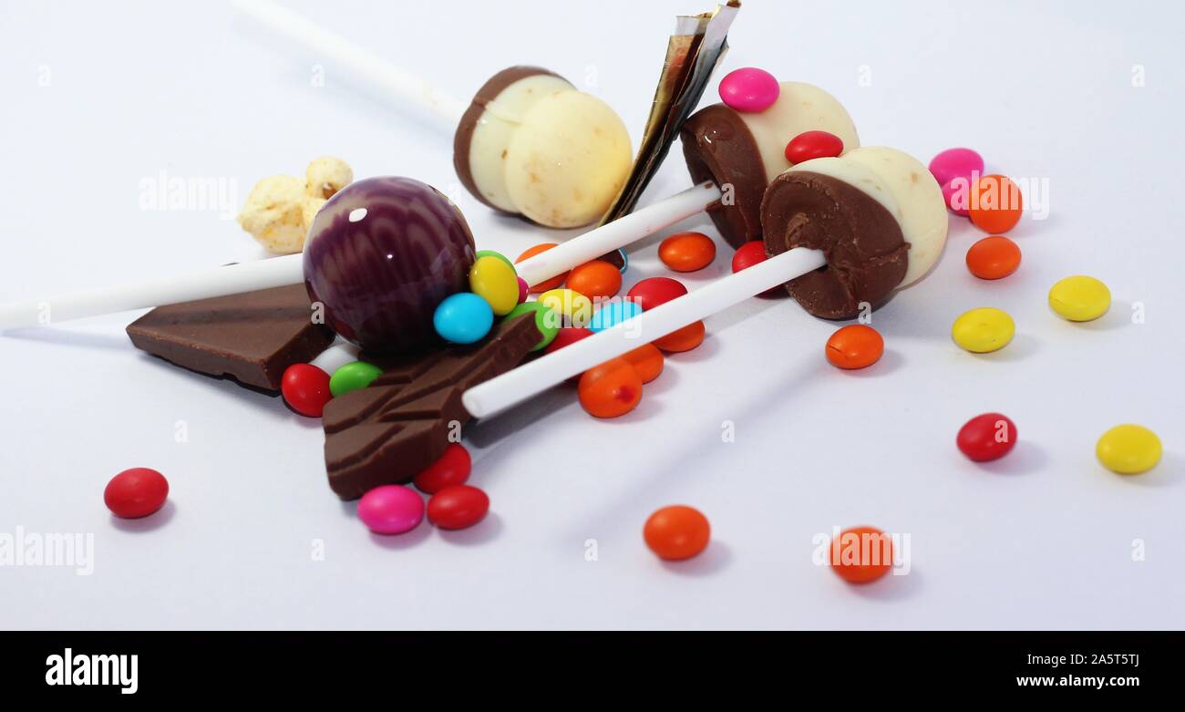 lollipop on a stick caramel of different colors on a white background Stock Photo