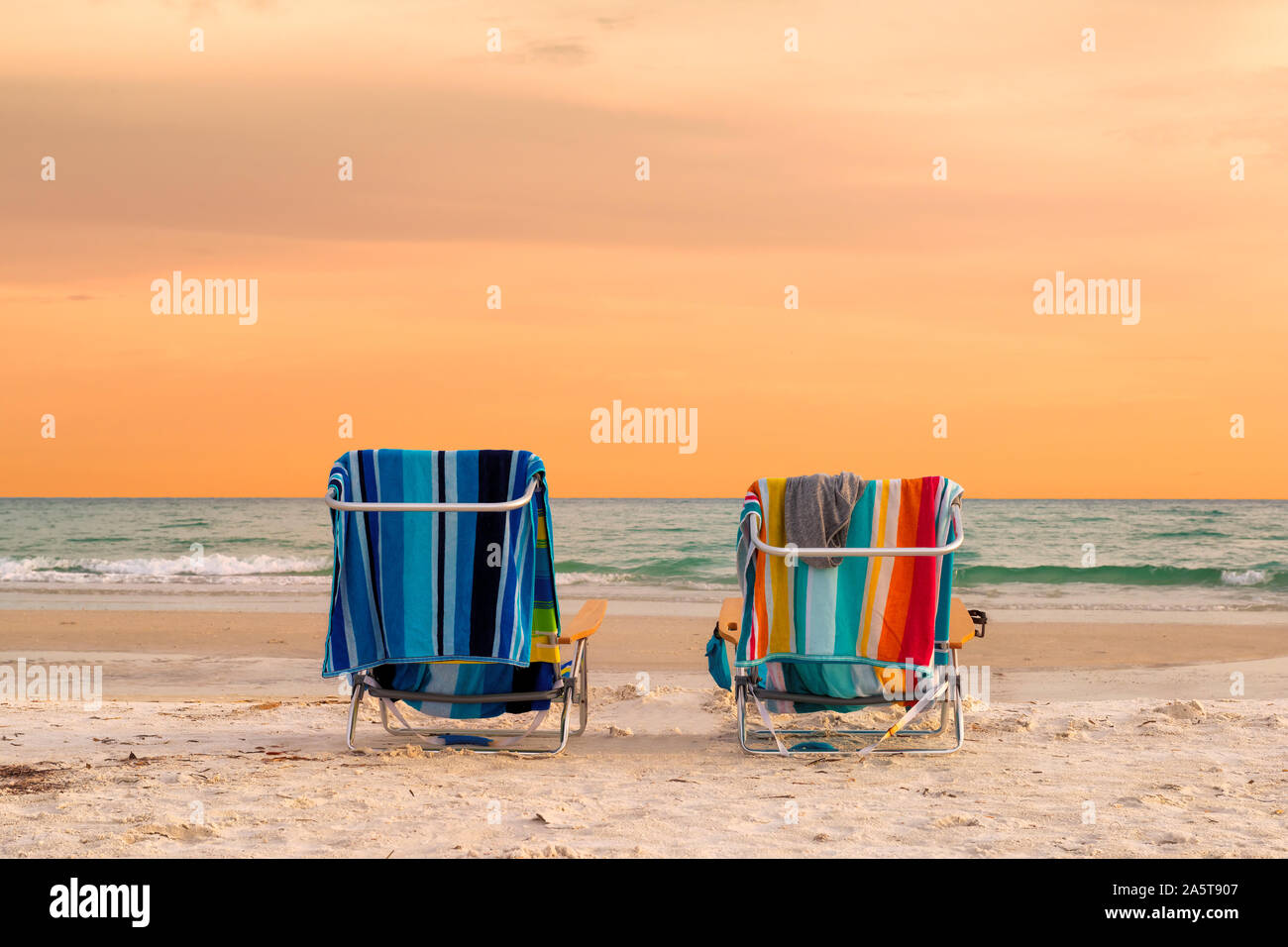 Beach chairs at sunset in Siesta Key Beach, Florida Stock Photo Alamy
