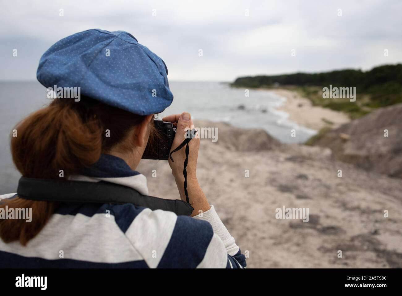 young woman on the beach with camera ,Bornholm Stock Photo - Alamy