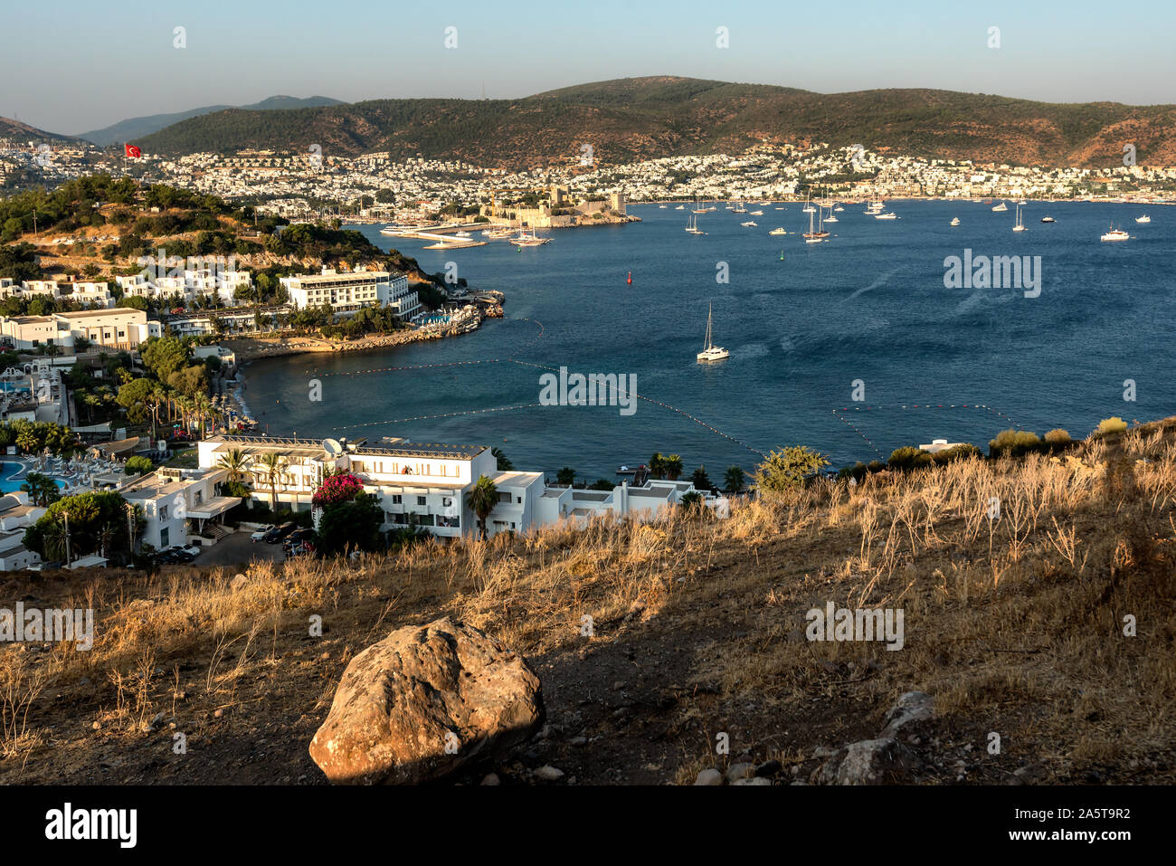 Panoramic Sunset view of Bodrum Castle and marina bay on Turkish Riviera. Bodrum is a district and a port city in Mugla Province, in the southwestern Stock Photo