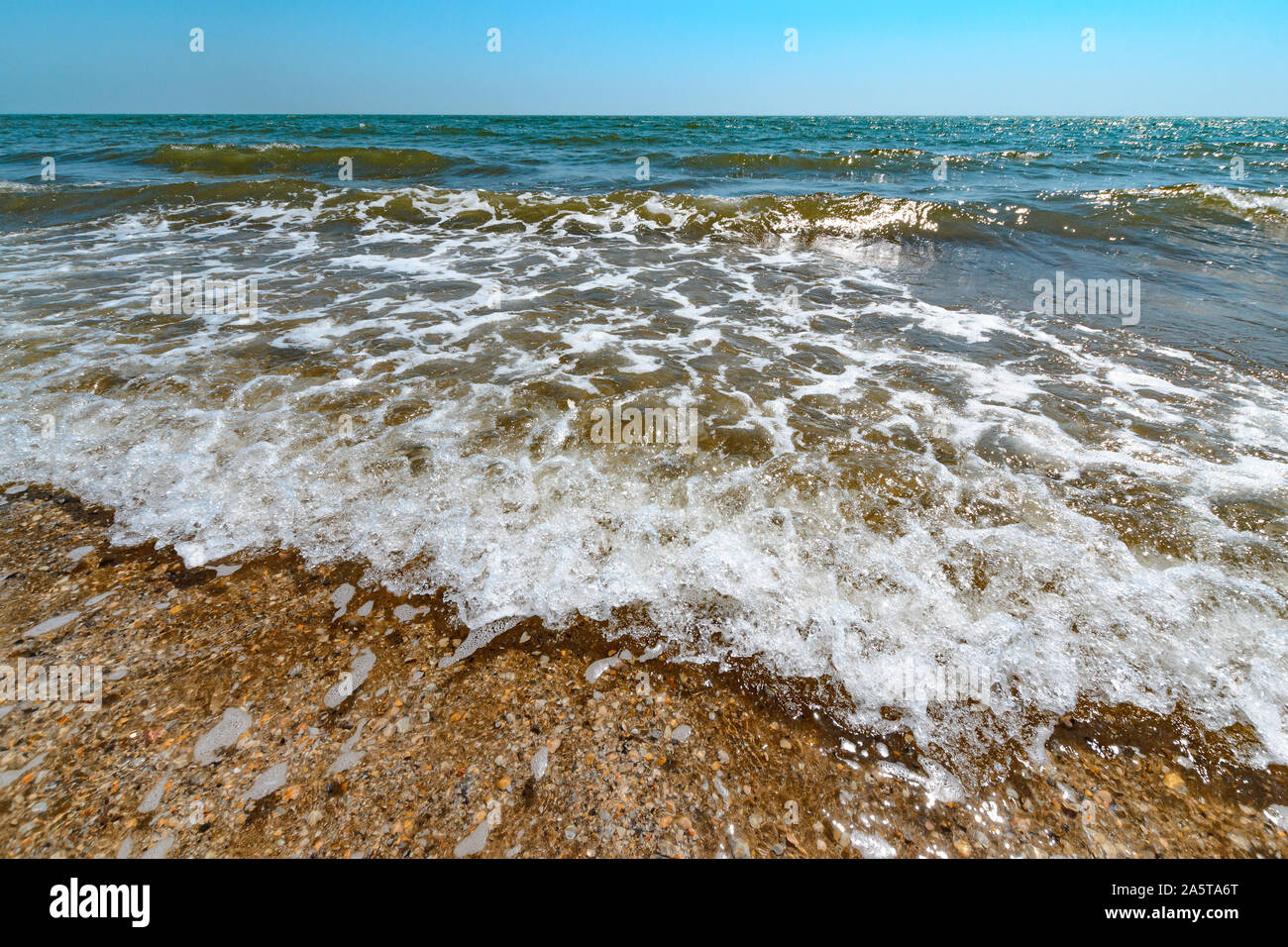 Sea view from tropical beach with sunny sky. Stock Photo