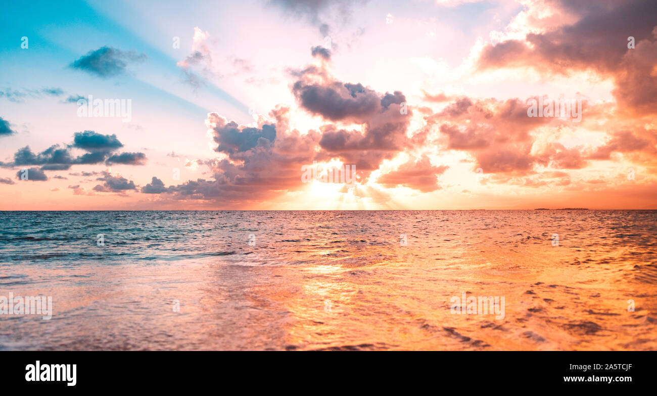 ocean sunset sky background with colorful clouds Stock Photo