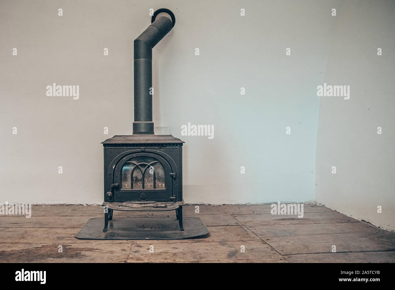 old stove in empty room Stock Photo