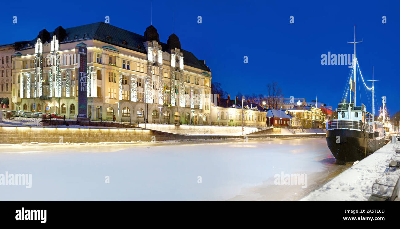 Turku, Finland. Beautiful view of  embankment of the river Aura on a winter by night. Stock Photo
