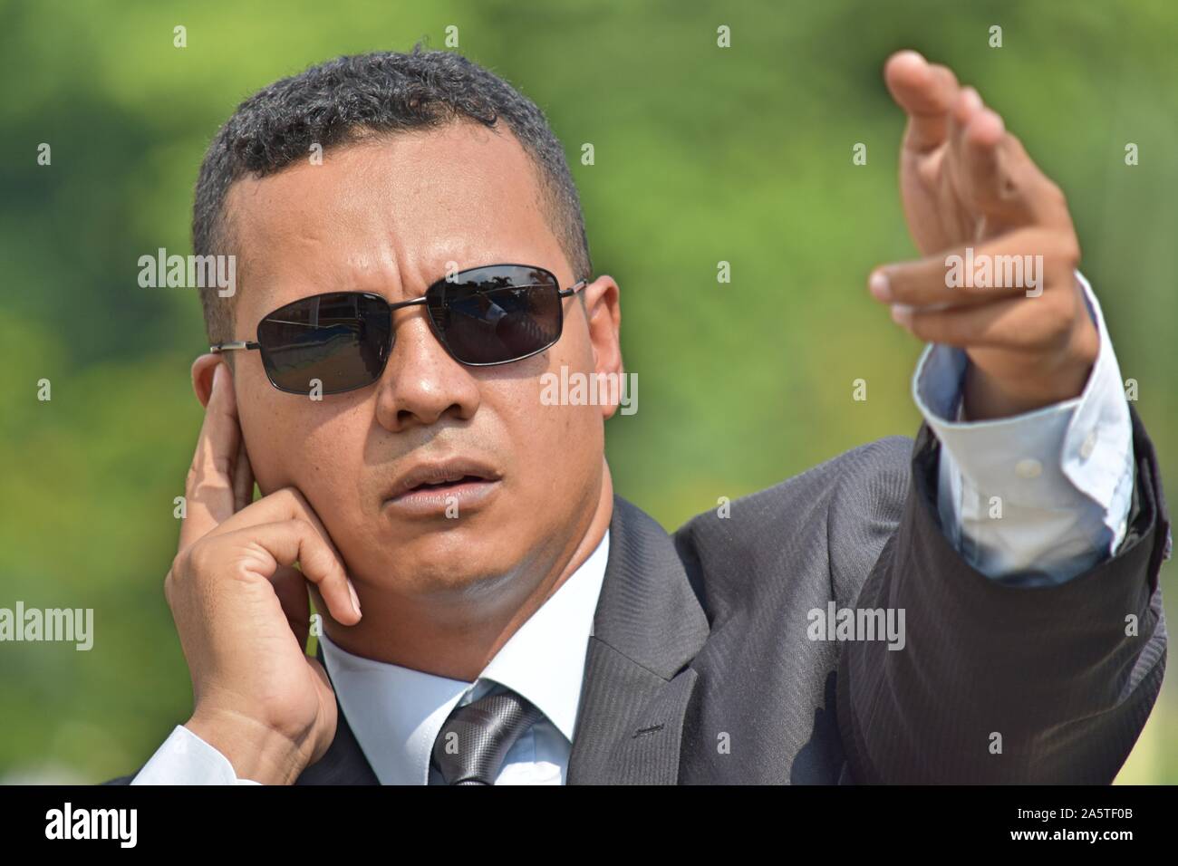 Young Security Guard Pointing Stock Photo - Alamy