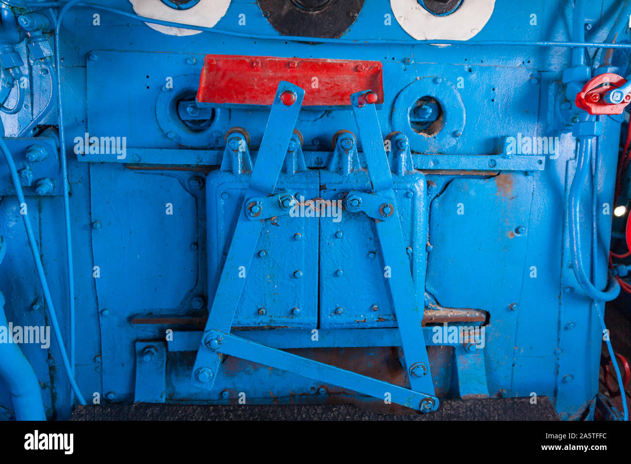 Cab in the historicall train locomotive in blue and red colors with manual control Stock Photo