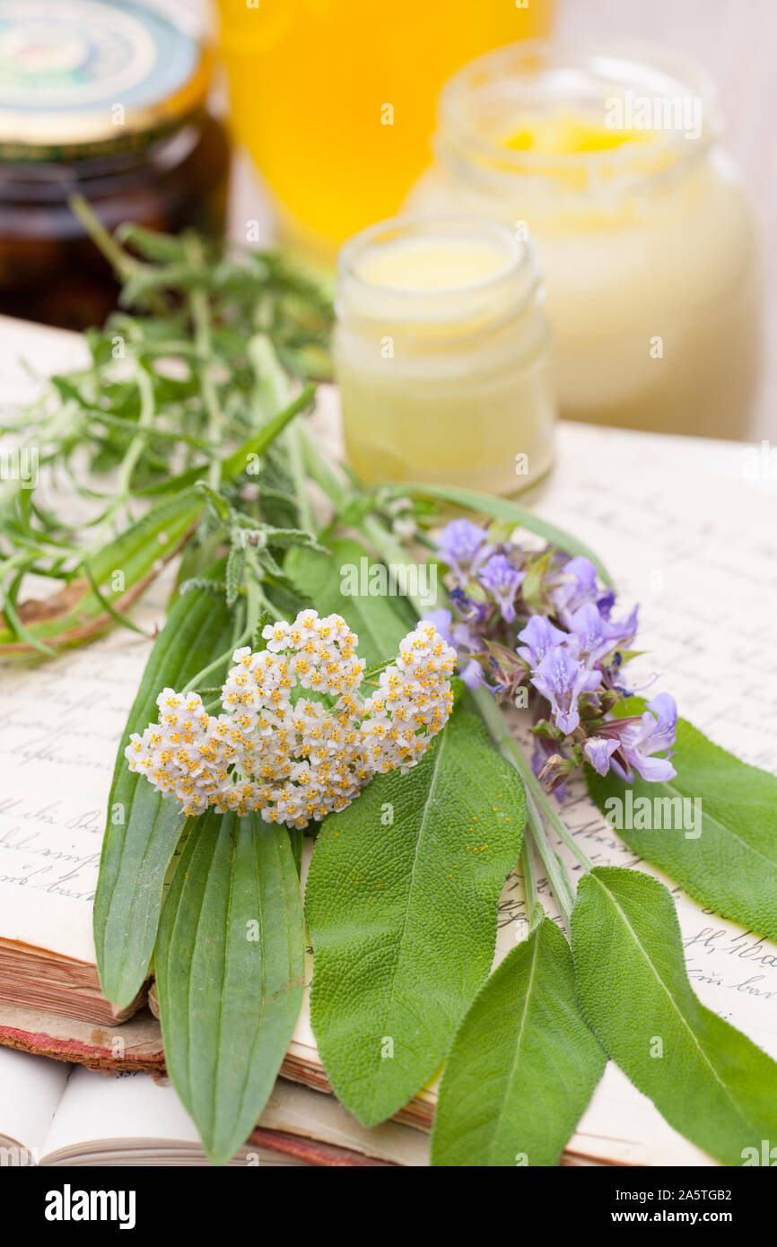 Old books with recipes, medicinal herbs and ointments Stock Photo