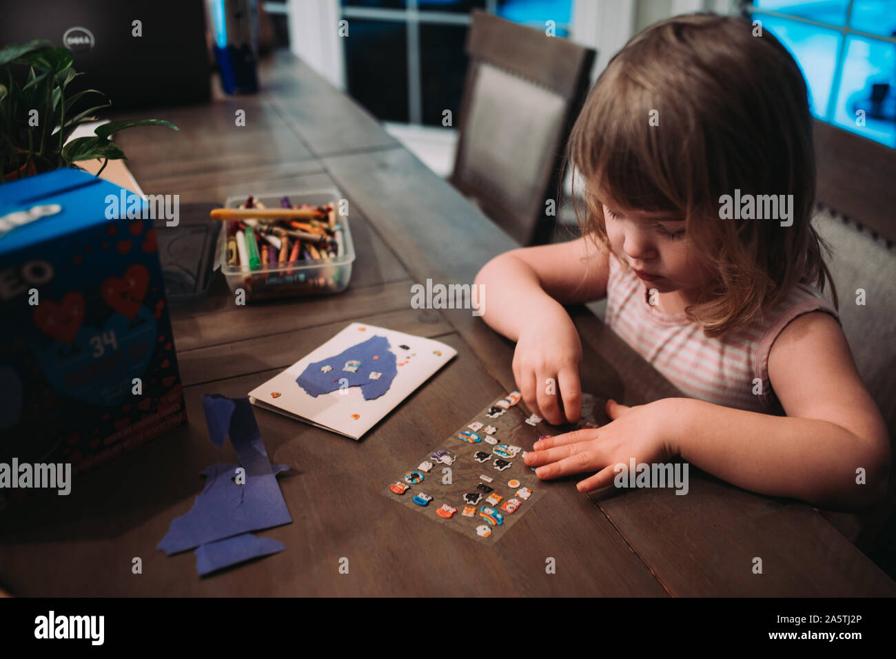 young girl making a card Stock Photo