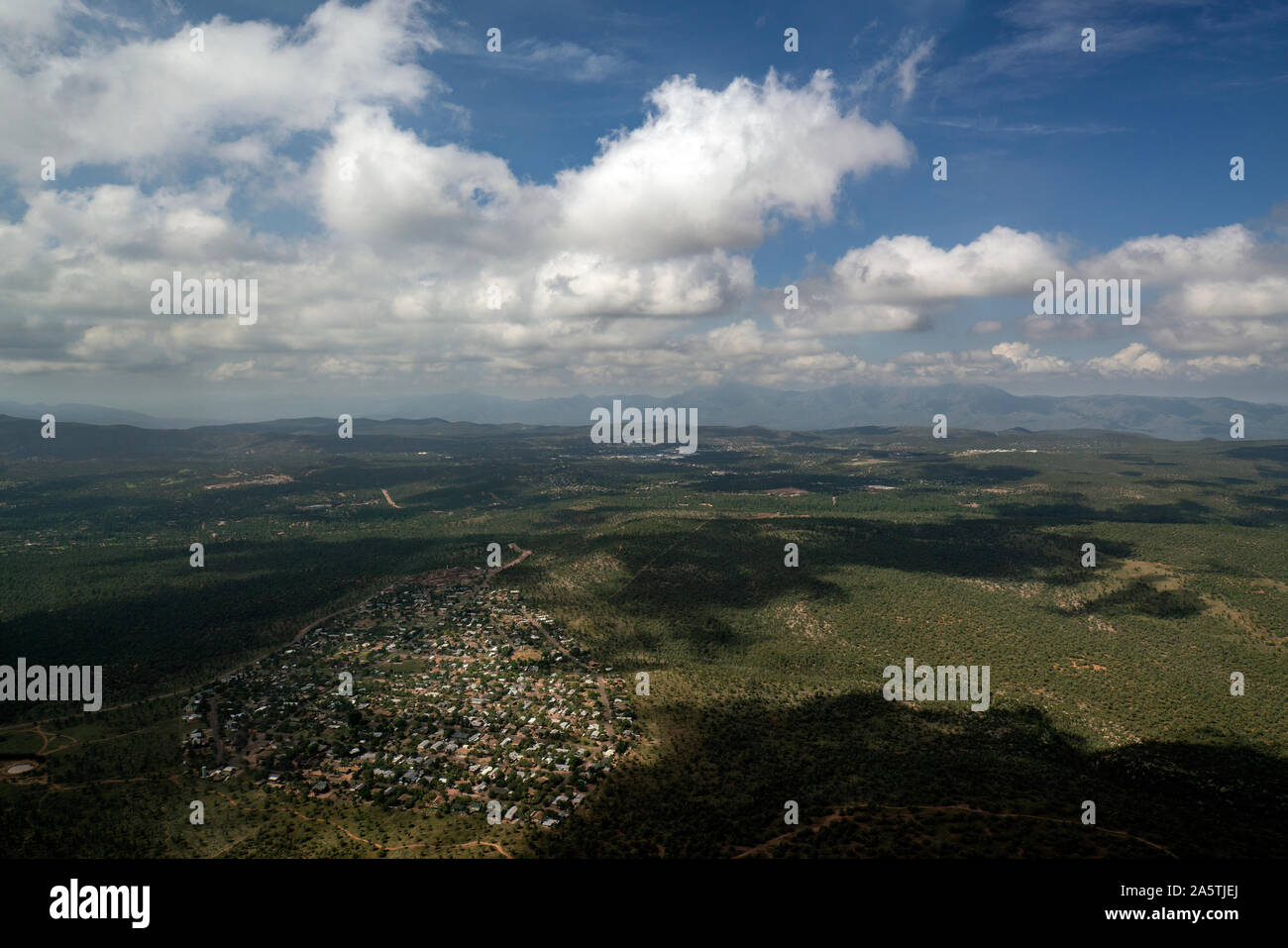 Aerial view looking down on a small village or town cloudy sky Stock Photo