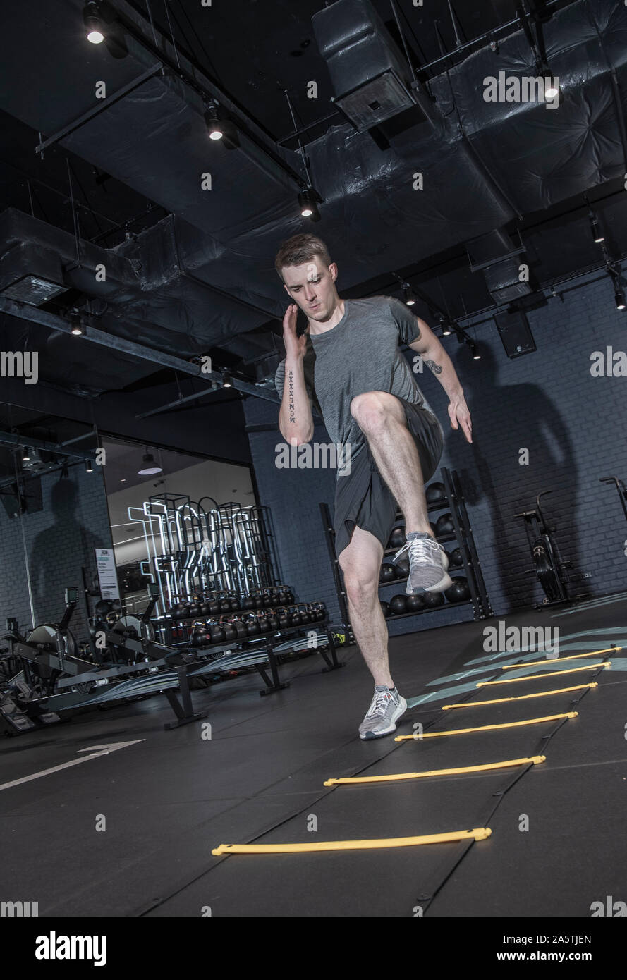 man working out in modern cross fit gym in Bangkok Stock Photo