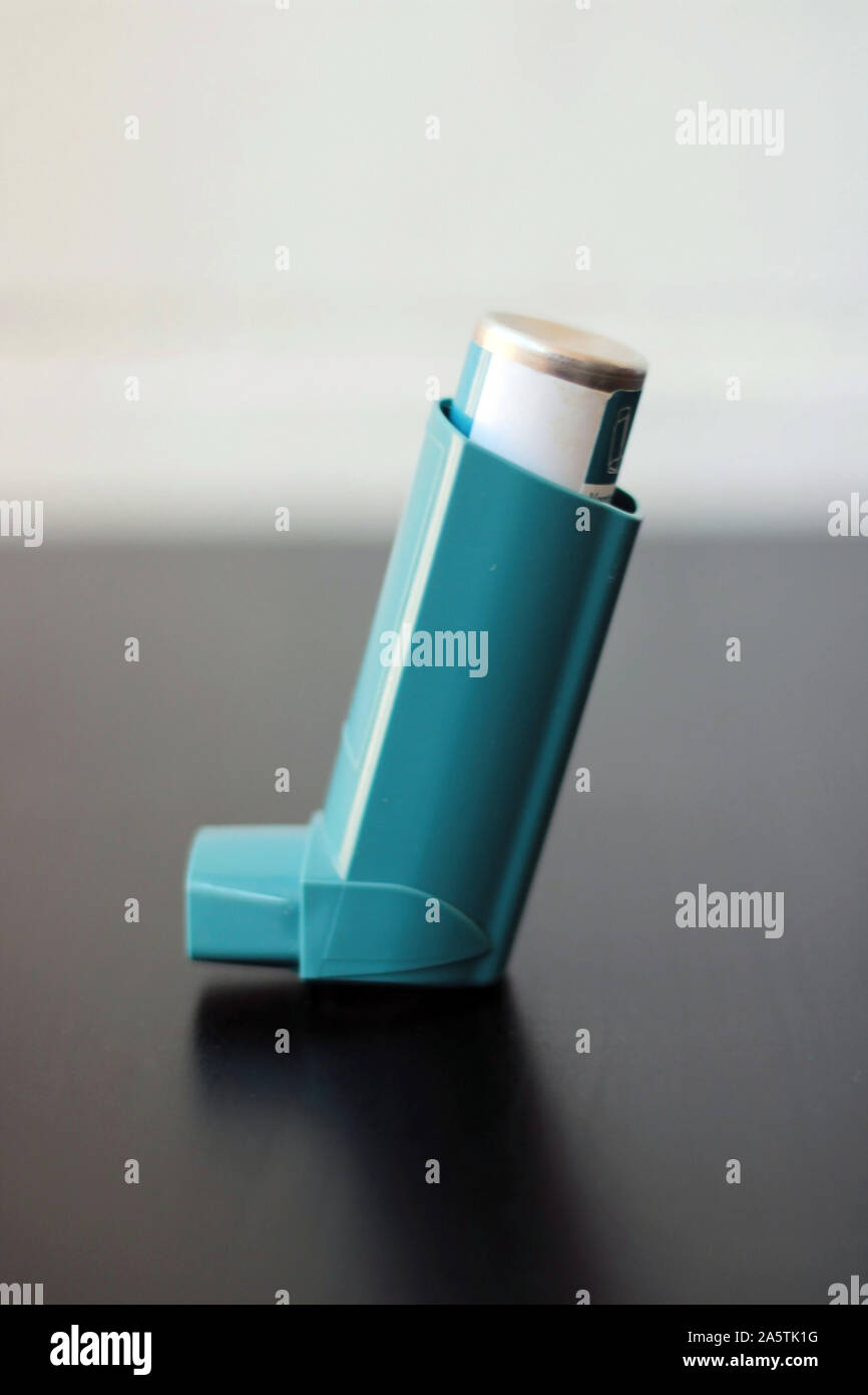 Medicine and health concept: Blue inhaler. Pharmaceutical product for ...