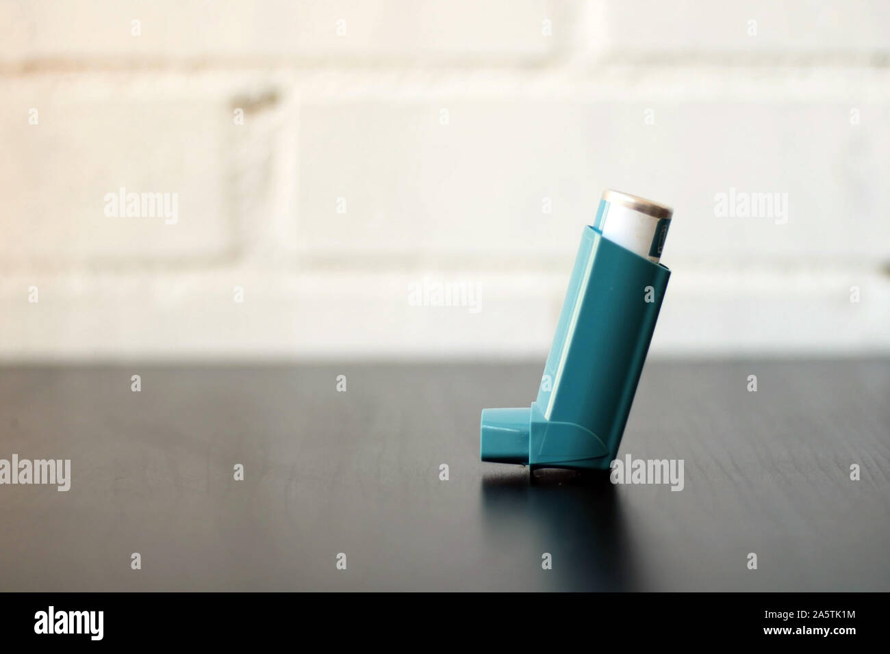 Medicine and health concept: Blue inhaler. Pharmaceutical product for ...