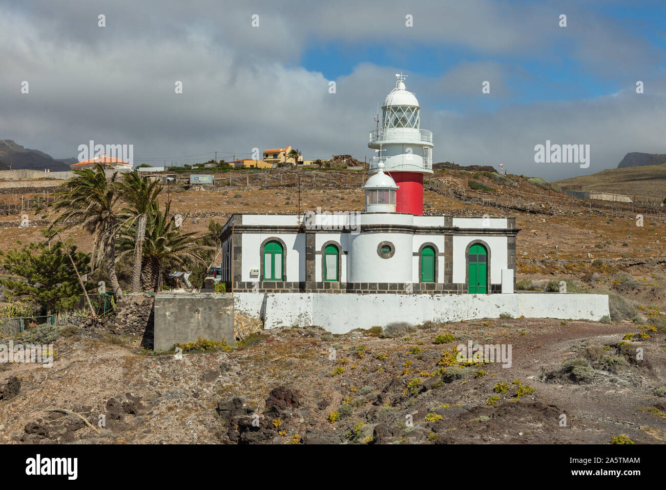 Lighthouse Faro de San Cristobal on Punta del Faro, located on a high rocky cliff in the vicinity of San Sebastian, the capital of the island of La Go Stock Photo